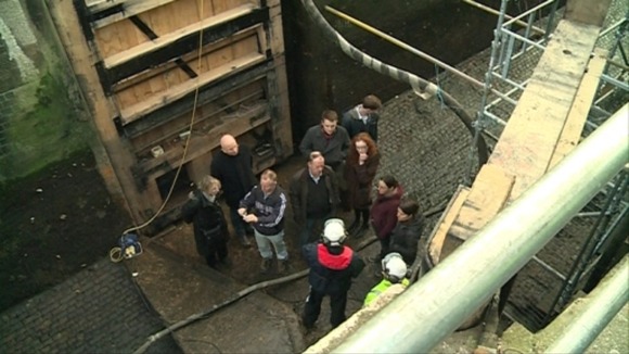 A tour group explores the lock