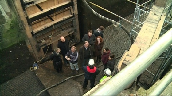 A tour group explores the lock