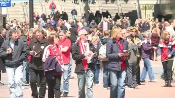 Fans arrive at the stadium
