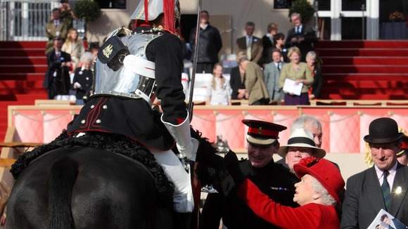 The Queen presents Trooper Morrison  with an award for best turned out trooper 