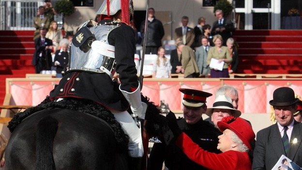 The Queen presents Trooper Morrison with an award for best turned out trooper