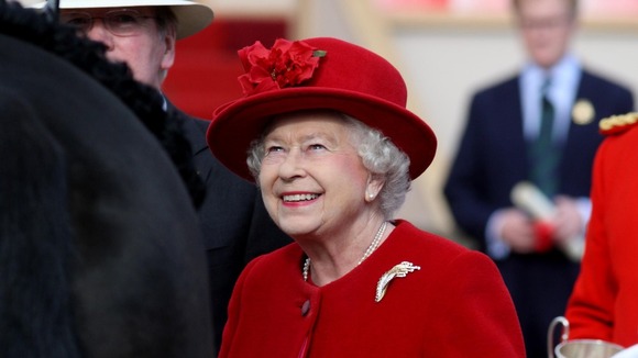 Queen at Windsor in red hat 