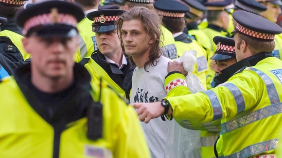 Police lead away an Occupy demonstrator near the Bank of England