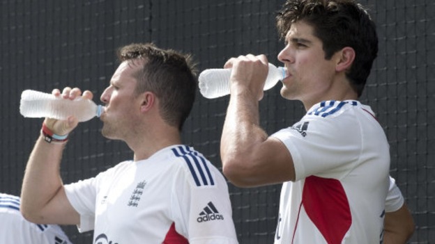 Alastair Cook takes some water on board alongside Graeme Swann during a recent nets session.