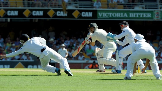 Bowling all-rounder Mitchell Johnson plays the ball just past the outstretched hand of Ian Bell.