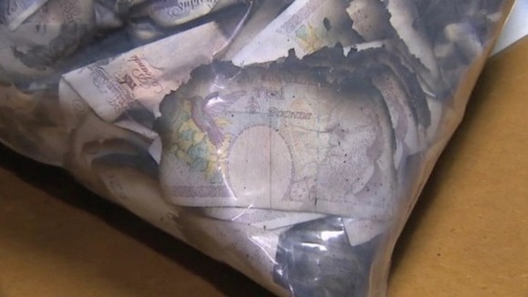 Police divers have finished their search of a river near Spalding, after £60,000 was found floating in the water.
