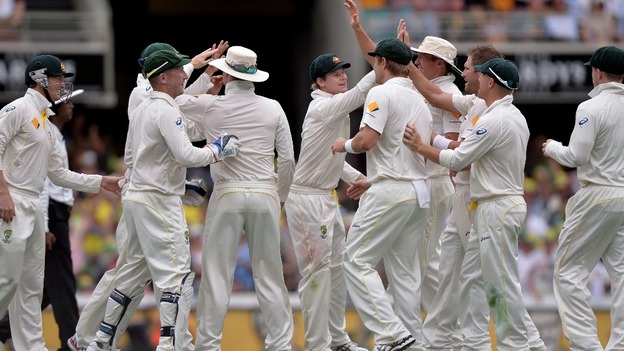 Australia celebrate after Nathan Lyon took the wicket of England's Chris Tremlett for 8 during day two of the first Ashes Test.