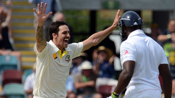 Australia's Mitchell Johnson celebrates the wicket of Michael Carberry in the first Ashes test.