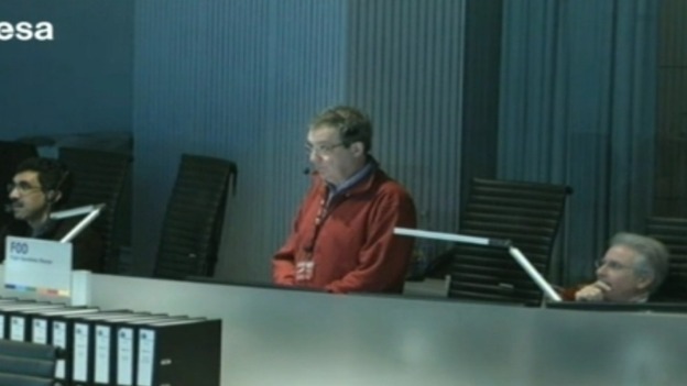 Operators watch on from the control room.