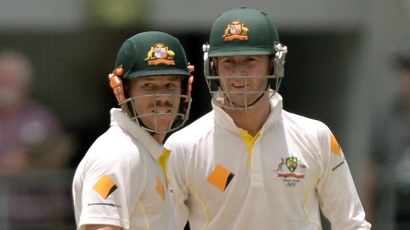 David Warner (left) and Michael Clarke (right) during day three of the first Ashes Test at The Gabba, Brisbane, Australia.