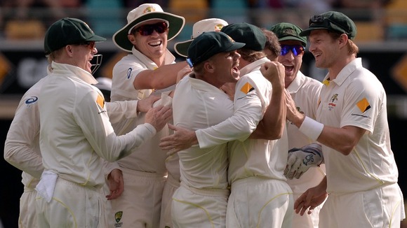 Australia's cricketers celebrate during day four of the first Ashes Test at The Gabba, Brisbane, Australia