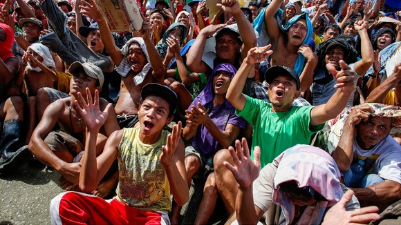 Tacloban residents react with job as Manny Pacquiao wins a decisive victory
