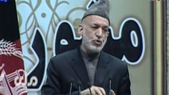 Afghan President Hamid Karzai addresses the Loya Jirga assembly.