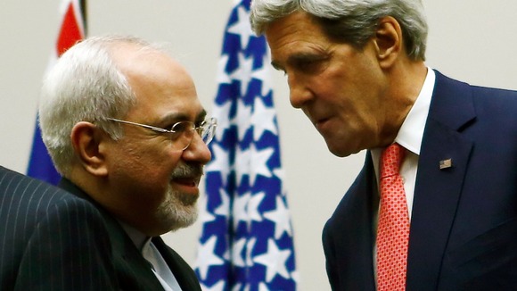 US Secretary of State John Kerry shakes hands with Iranian Foreign Minister Mohammad Javad Zari.