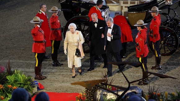 Four Canadian Mounties saluted her on arrival