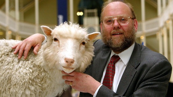 Professor Ian Wilmut poses with 'Dolly' - the world's first cloned sheep