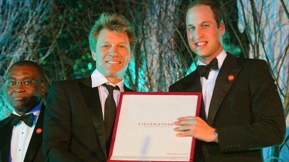 The prince presents Jon Bon Jovi with the Centrepoint Great Britain Youth Inspiration Award.