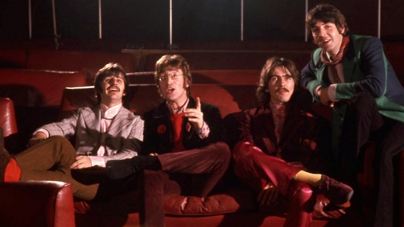 The collection contains previously unpublished colour pictures of The Beatles pretending to watch the film.