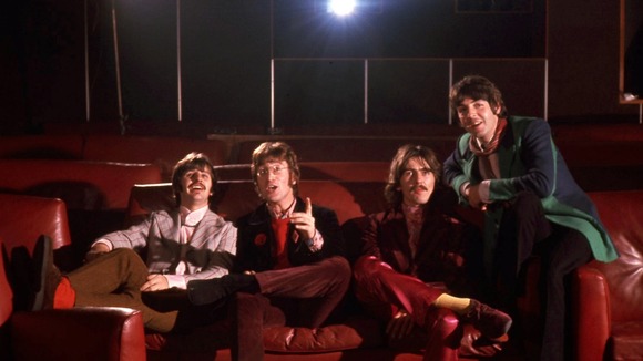 The collection contains previously unpublished colour pictures of The Beatles pretending to watch the film.