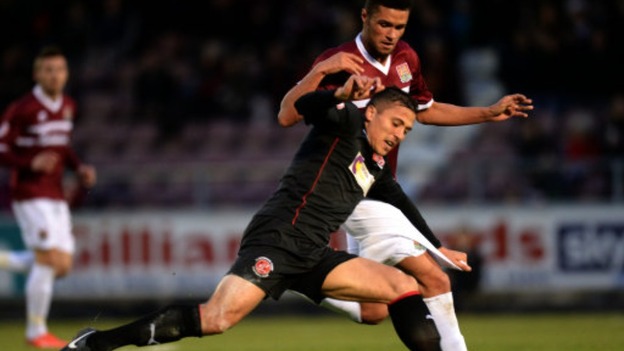 Kane Ferdinand challenges Fleetwood Town midfielder Antoni Sarcevic in a recent match.