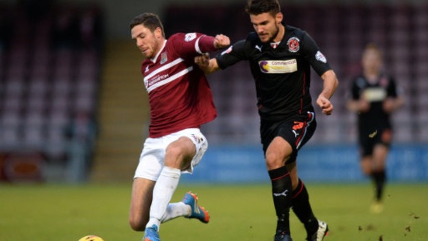 Ben Tozer challenges for the ball in Northampton's recent clash with Fleetwood Town.