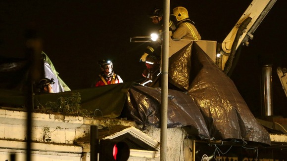 Members of the emergency services working on the roof of the Clutha Bar in Glasgow
