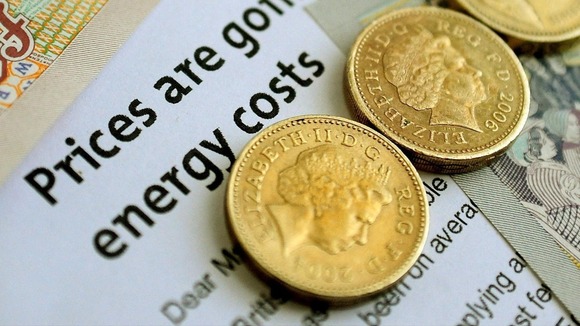 An energy bill letter and money.