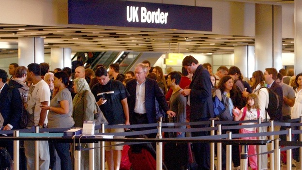 Passenger wait at immigration queues at Heathrow