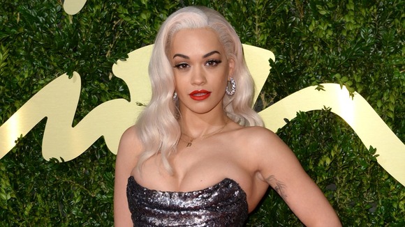 Rita Ora, arriving at The British Fashion Awards 2013, is to star in Fifty Shades of Grey.