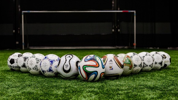 The brazuca sits in front of precious match balls.
