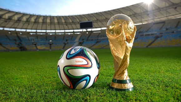 The brazuca and World Cup trophy in the Parque Lage in Rio de Janeiro.