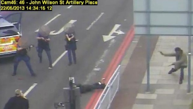 Michael Adebowale (right) runs down the footpath as Michael Adebolajo is down on the road.