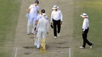 England's James Anderson (second left) exchanges words with Australia's Michael Clark