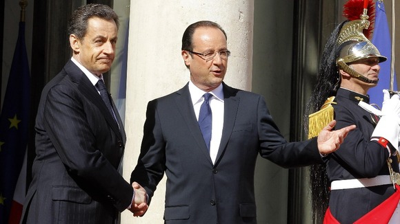 Outgoing president Nicolas Sarkozy with Francois Hollande.