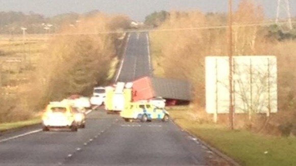 The lorry on its side on the A801 in Scotland
