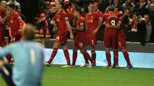 Luis Suarez celebrates one of his four goals.