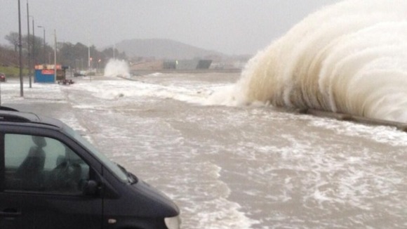 Waves crash on loan in Porth Eirias in Wales