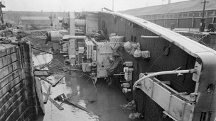 British frigate HMS Berkeley Castle lies on her side in Sheerness naval dockyard after she had capsized by the floods