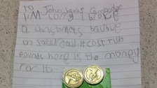 The letter sent to John Lewis from Faith including two, one pound coins.