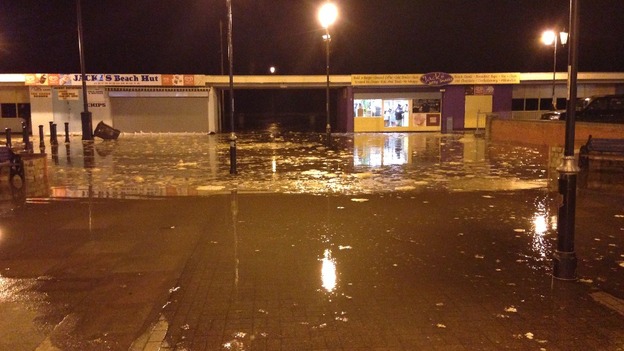 Water has begun to flood over the pier in Great Yarmouth.