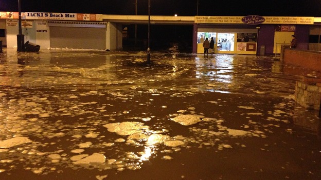 Water has begun to flood over the pier in Great Yarmouth.