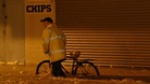 A man pushes his bike through flood water in Great Yarmouth in Norfolk