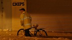 A man pushes his bike through flood water in Great Yarmouth in Norfolk