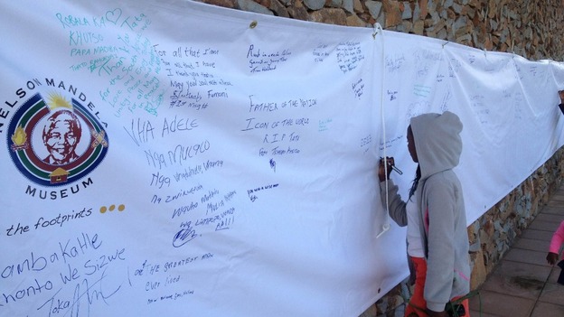 People have been leaving tributes in honour of Nelson Mandela outside the museum.