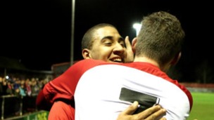Glenn Walker and Elliot Sandy embrace after knocking out Gillingham.