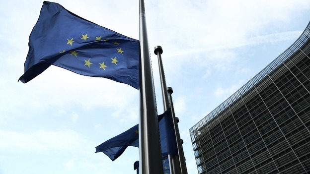The United Nations flags fly at half mast across the street from the South African embassy in Brussels.