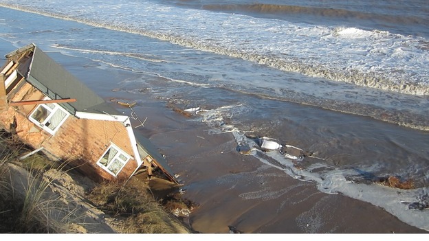 One of the five bungalows in Hemsby, Norfolk which fell into the sea.