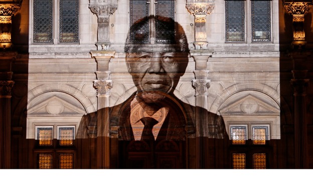 The face of Nelson Mandela is projected on the facade of Paris City Hall.