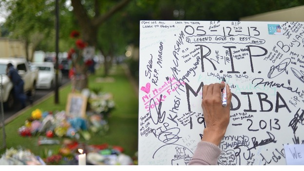 There is a mixture of sorrow and celebration in Johannesburg after the death of Nelson Mandela.