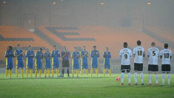 Port Vale and Salisbury City hold a minutes applause for Nelson Mandela.